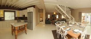 Panorama showing lounge, kitchen and dining room